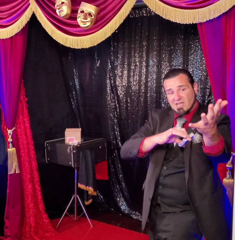 San Diego Magicians Matthew King at corporate virtual magic show card magic trick showing sleeve in front of red theater curtains