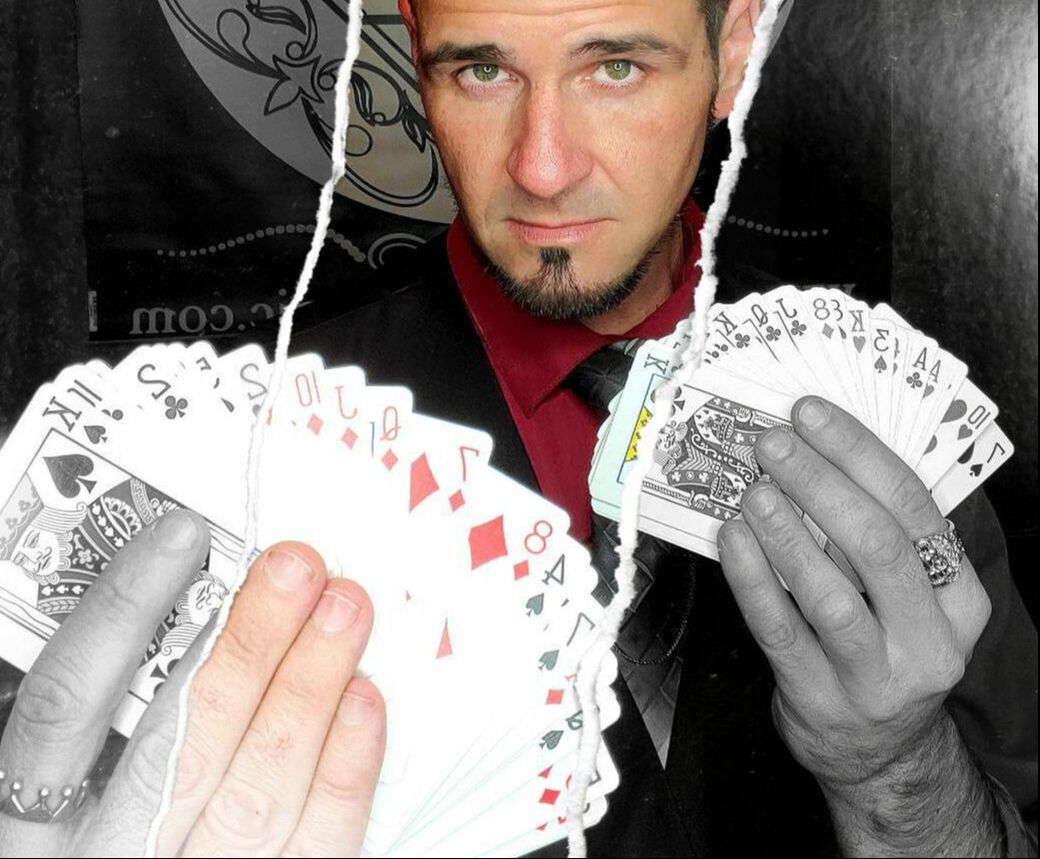 San Diego magician Matthew King with a fan of cards in each hand showing card magic. The image appears torn with alternating black and white photo with color