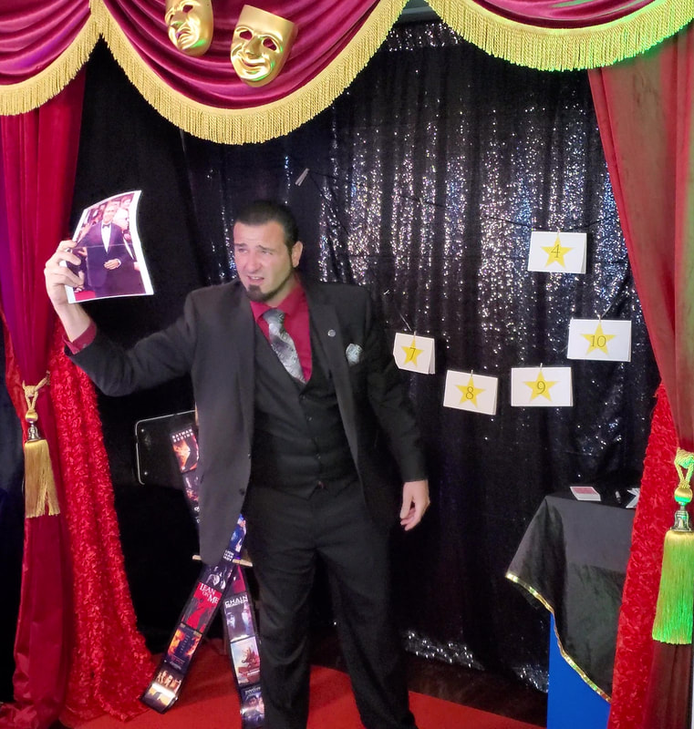 San Diego Magician Matthew King mentalist at corporate virtual magic show celebrity magic trick showing photo in front of red theater curtains